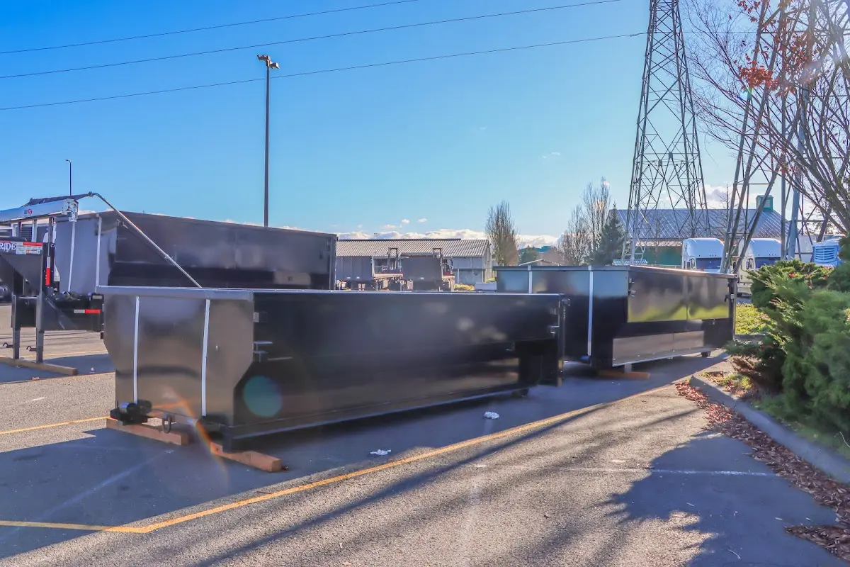 Roll-off dumpster ready for waste disposal at job site for Concrete Dumpster Rental in Hamilton
